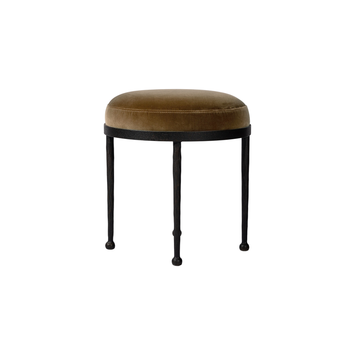 Florian Stool shown at an angle with domed ochre velvet seat, hammered iron frame and ball-foot legs.