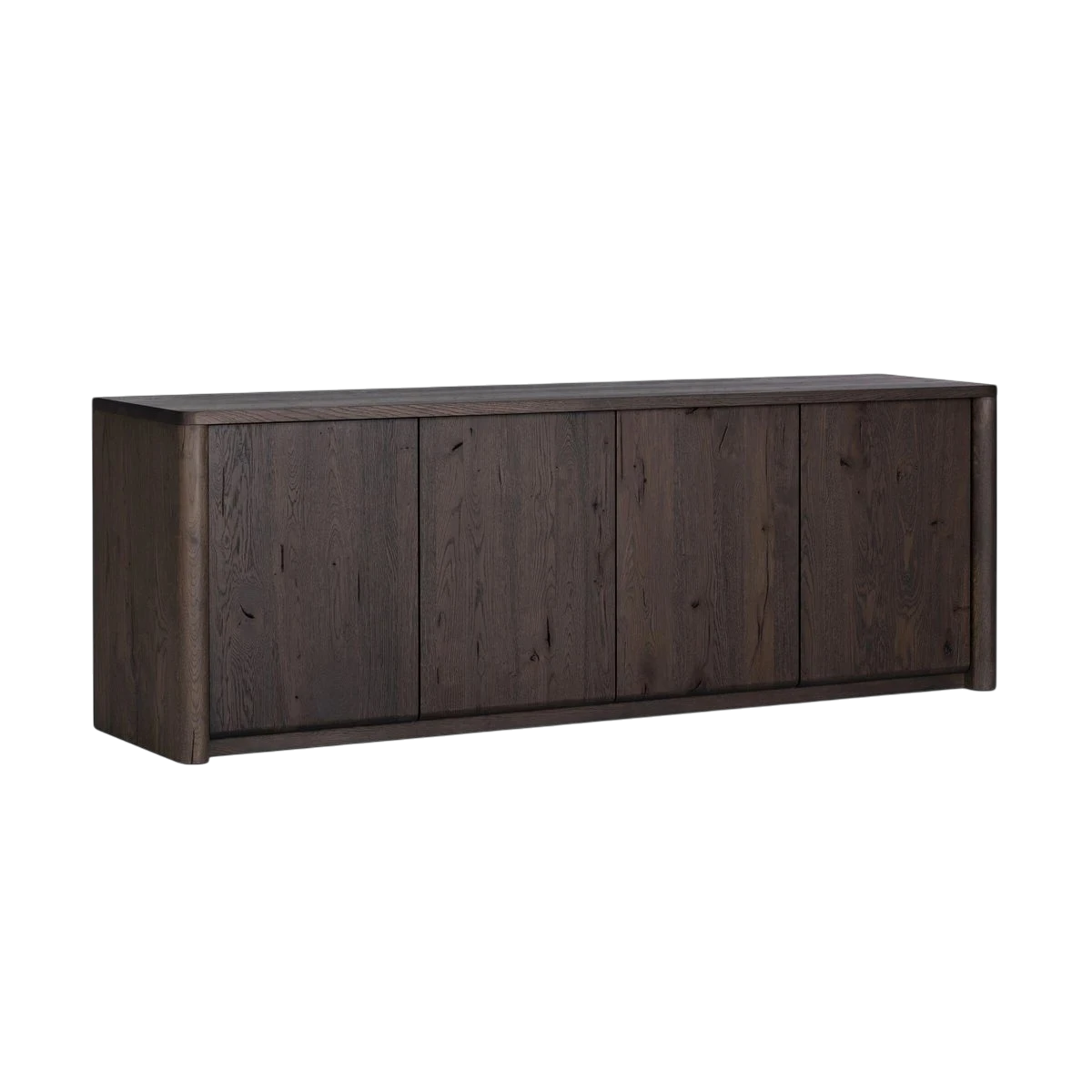 Angled view of the Hewitt Sideboard highlighting its dark oak finish, four-door façade and gently rounded outer frame.