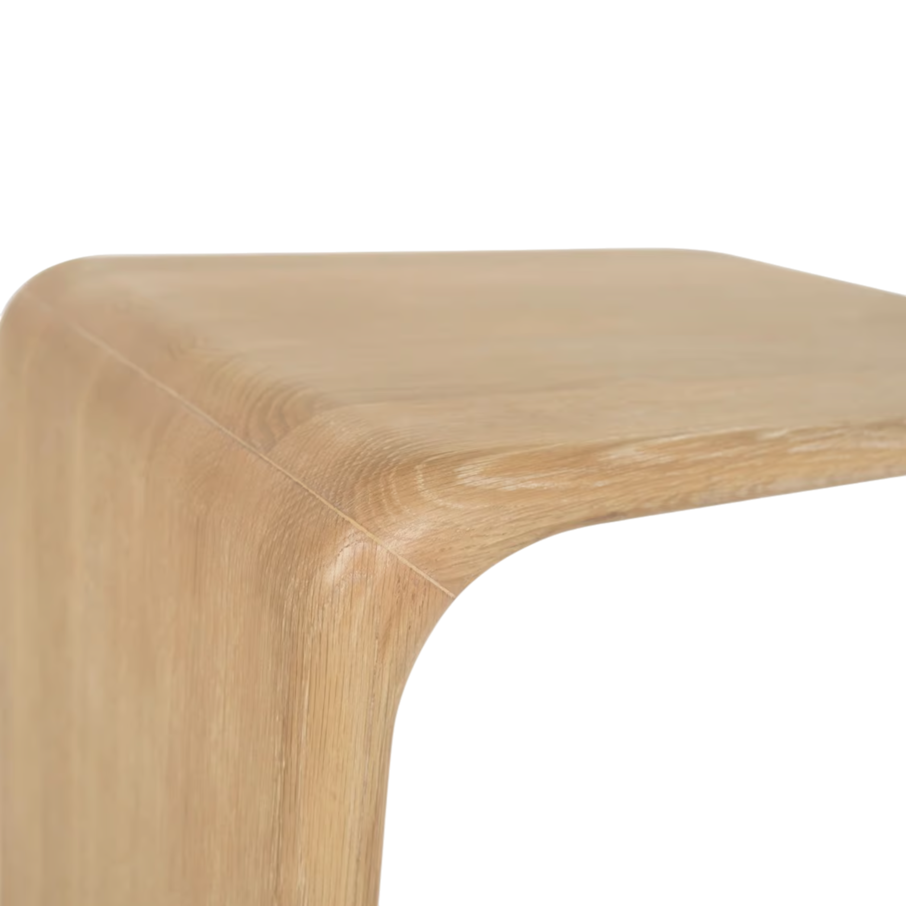 Close-up of the Tribute Side Table highlighting the softly rounded corner, smooth finish and wood grain.