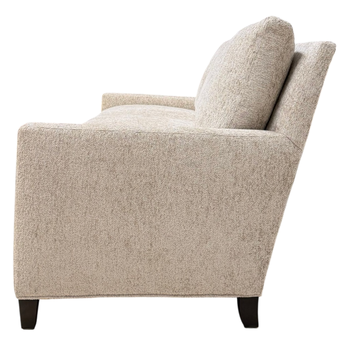 Side view of the Weston Sofa highlighting its low-profile frame, angled back, slim track arm and plush cushioning.