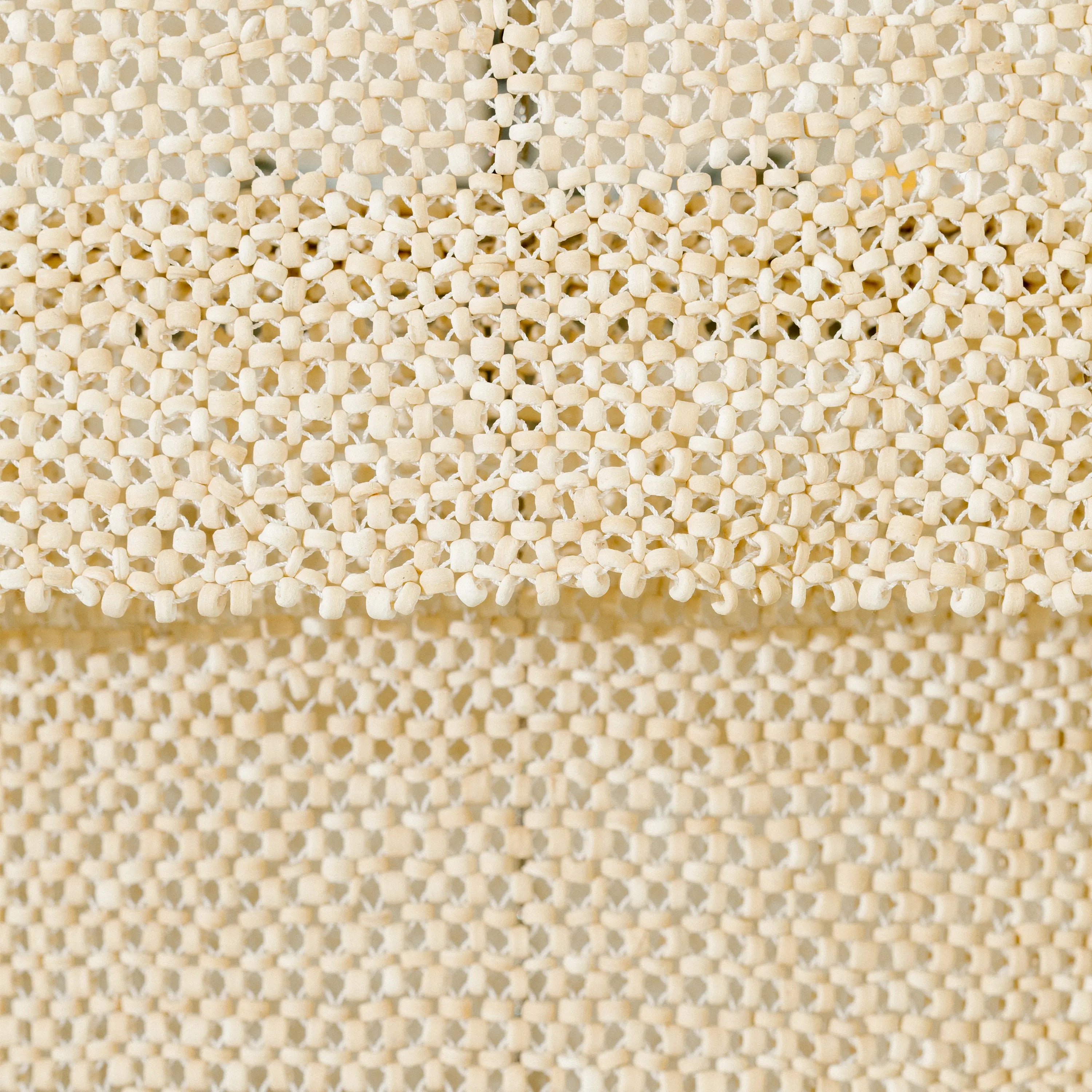 The Tiered Coco Bead Chandelier features clingy panels.