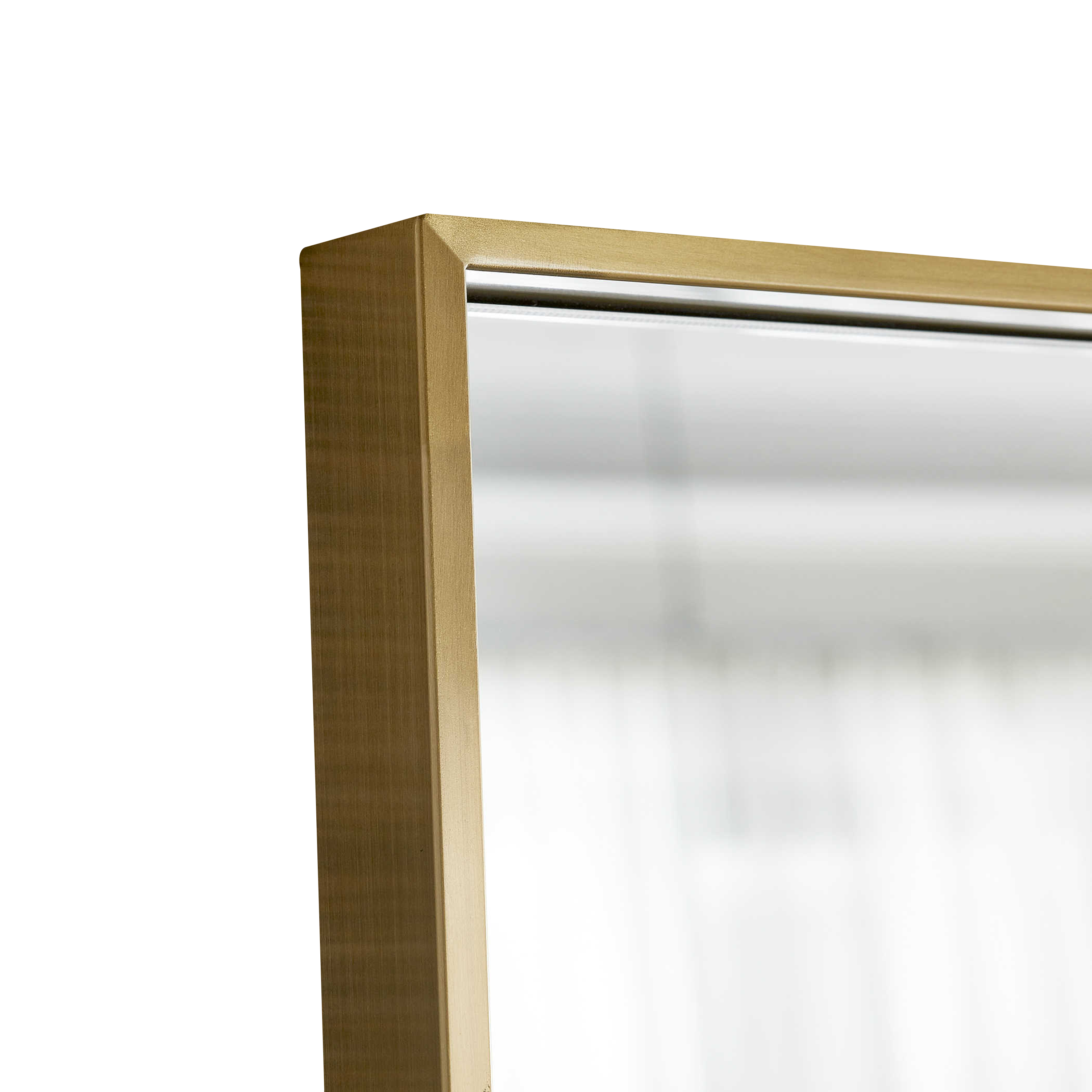 The Gallery Floor Mirror features a slim stainless steel frame that is finished in a light plated brushed brass.