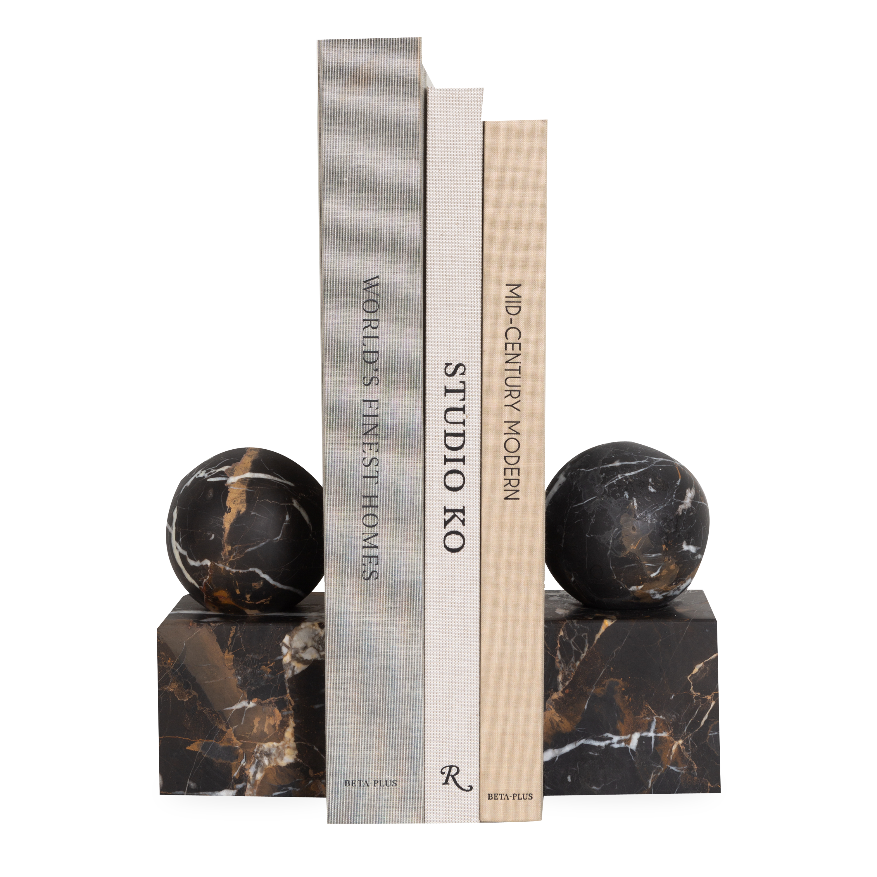 The Honed Marble Bookends feature a geometrical silhouette with a sphere sitting on a cube.