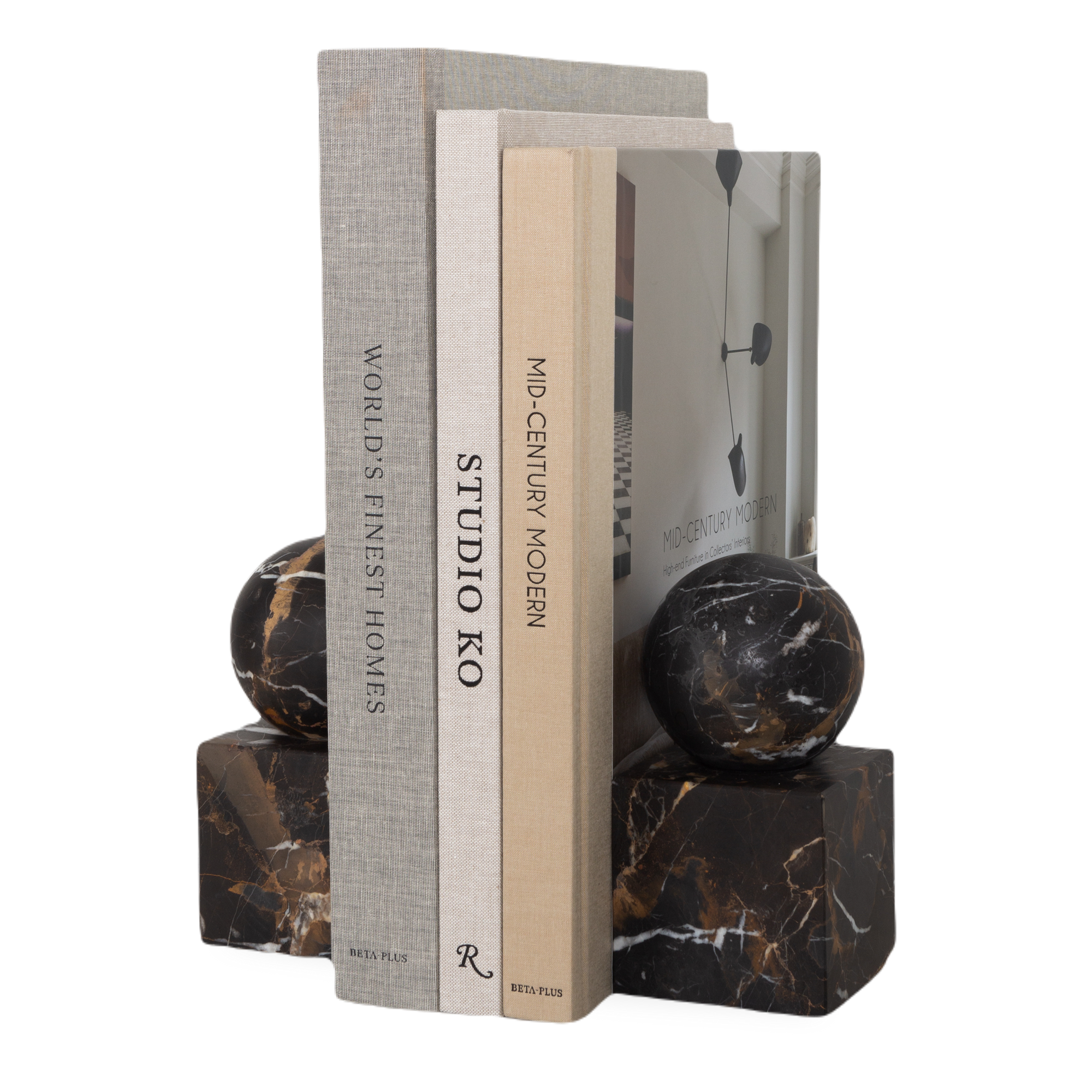 The Honed Marble Bookends feature a geometrical silhouette with a sphere sitting on a cube.