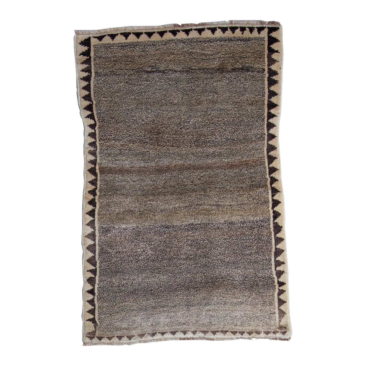 A rectangular area rug with a textured, heathered brown and gray center and a geometric border featuring black triangles on a cream background.