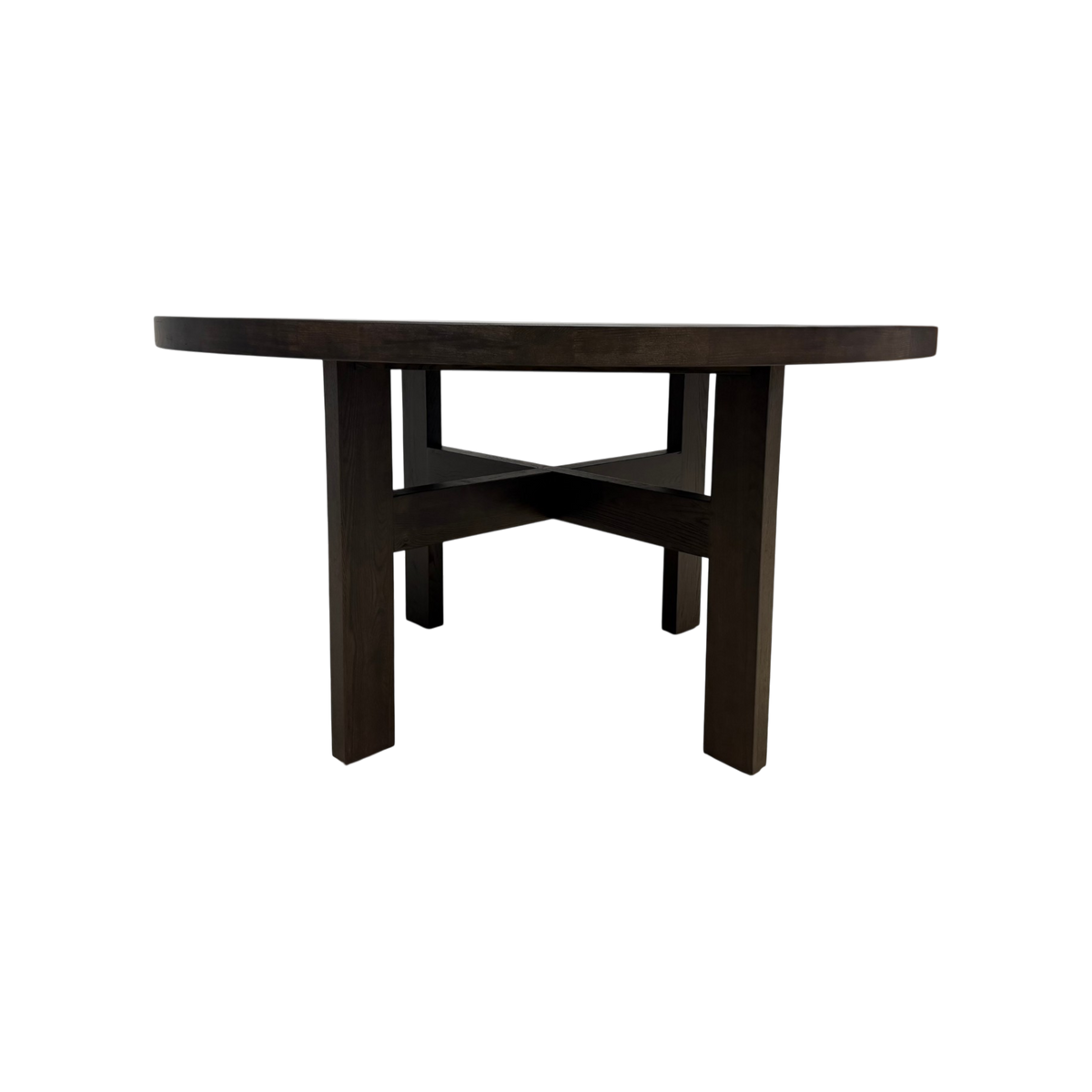 Rear view of Chino Dining Table showing the dark smoked ash finish and geometric crossed stretcher base.