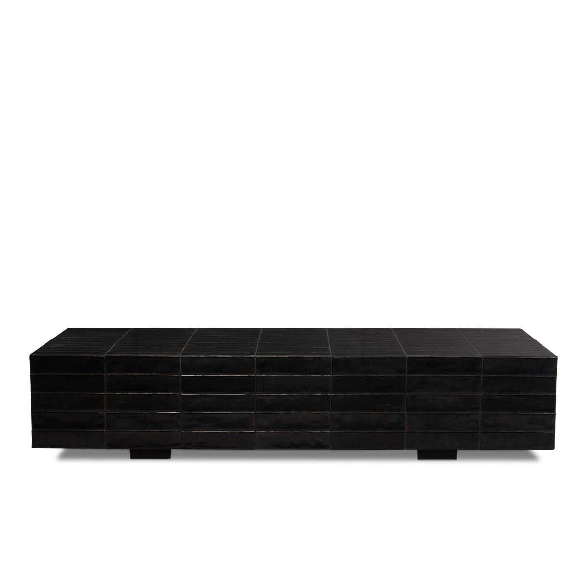 Bloor Coffee Table shown straight from the front in Black glazed tile, with five courses of narrow tiles and a low, elongated profile on two block feet.