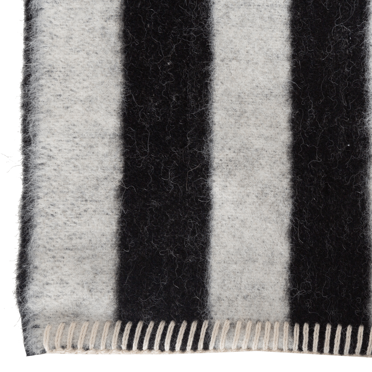 Presenting a luxuriously soft texture, the Stills Stripe Throw is woven with natural superfine alpaca wool and undyed Peruvian cotton.
