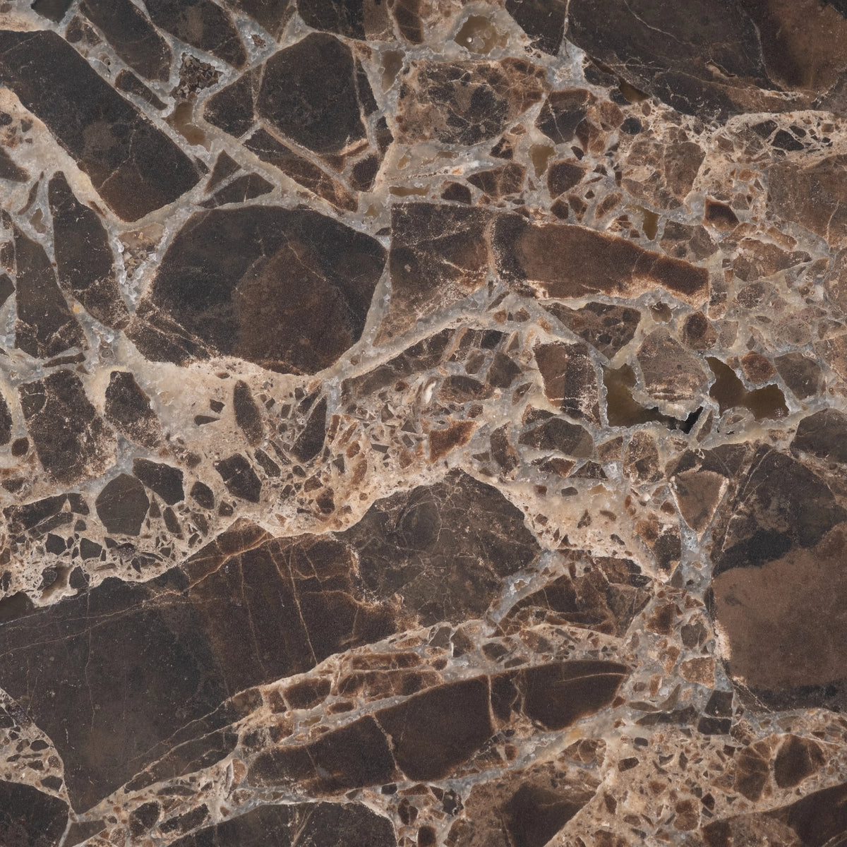 Shift Console Table close-up showing chocolate brown Dark Emperador marble, with angular brown fragments set in a web of cream and gray veining.