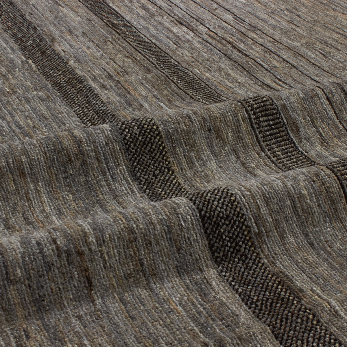 Revered for its lustre and soft hand, the natural qualities of wool from ancient Karakul sheep are honoured through restraint and refinement.