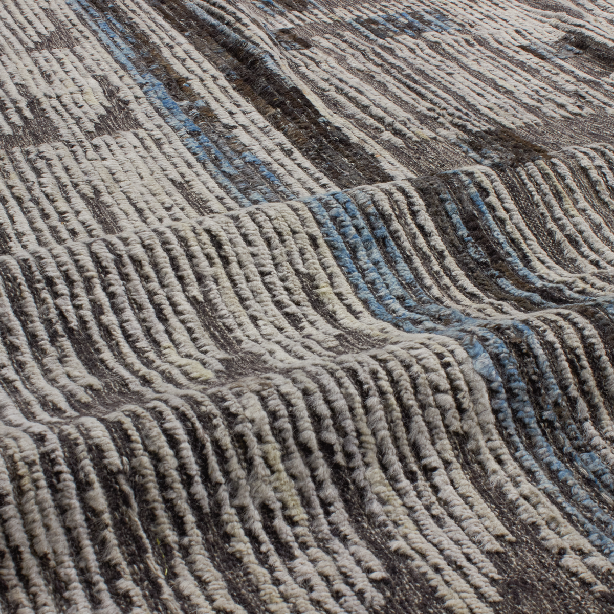 Revered for its lustre and soft hand, the natural qualities of wool from ancient Karakul sheep are honoured through restraint and refinement.