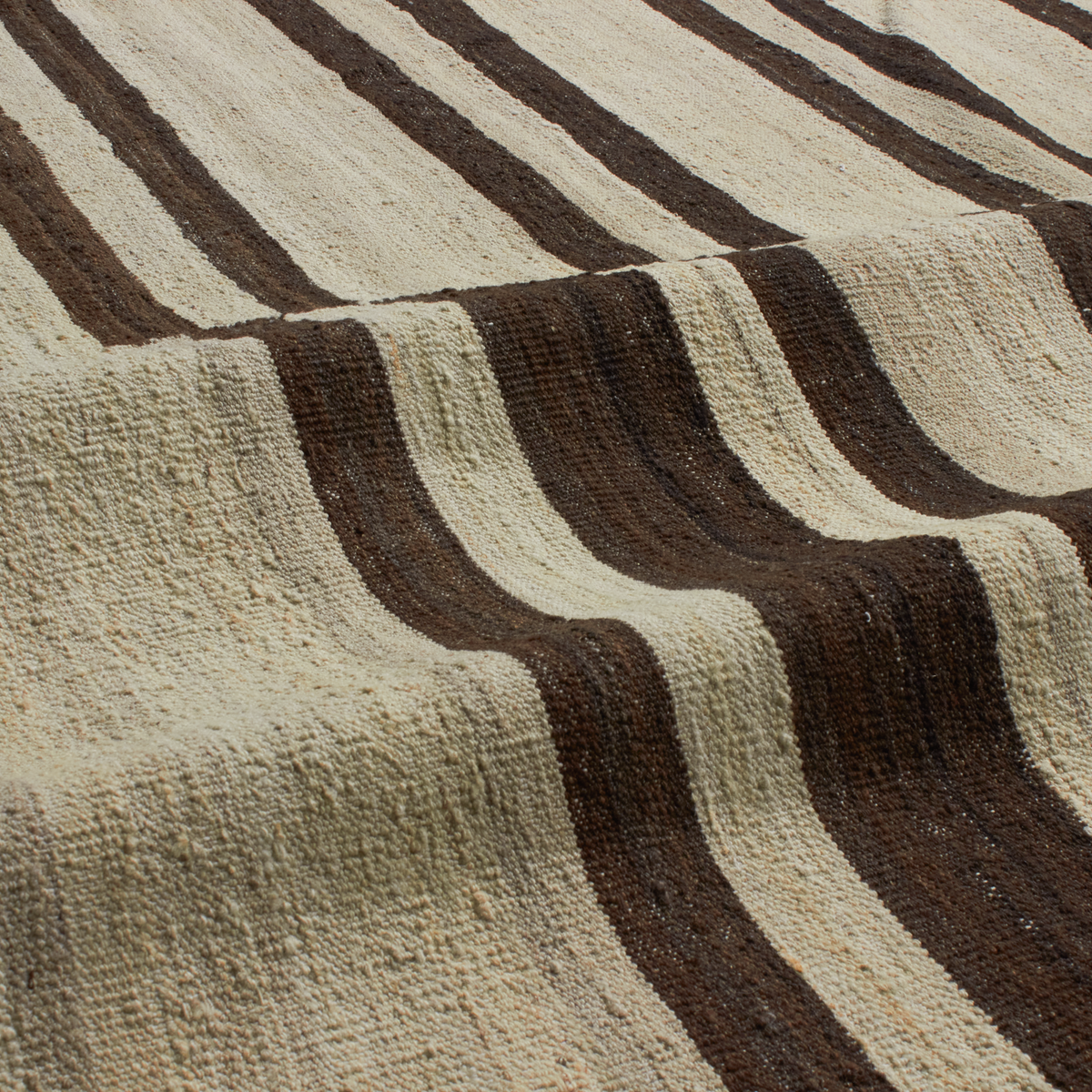 Revered for its lustre and soft hand, the natural qualities of wool from ancient Karakul sheep are honoured through restraint and refinement.