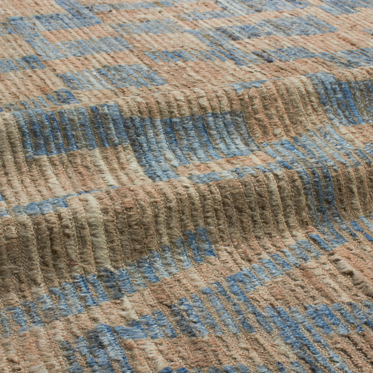 Revered for its lustre and soft hand, the natural qualities of wool from ancient Karakul sheep are honoured through restraint and refinement.