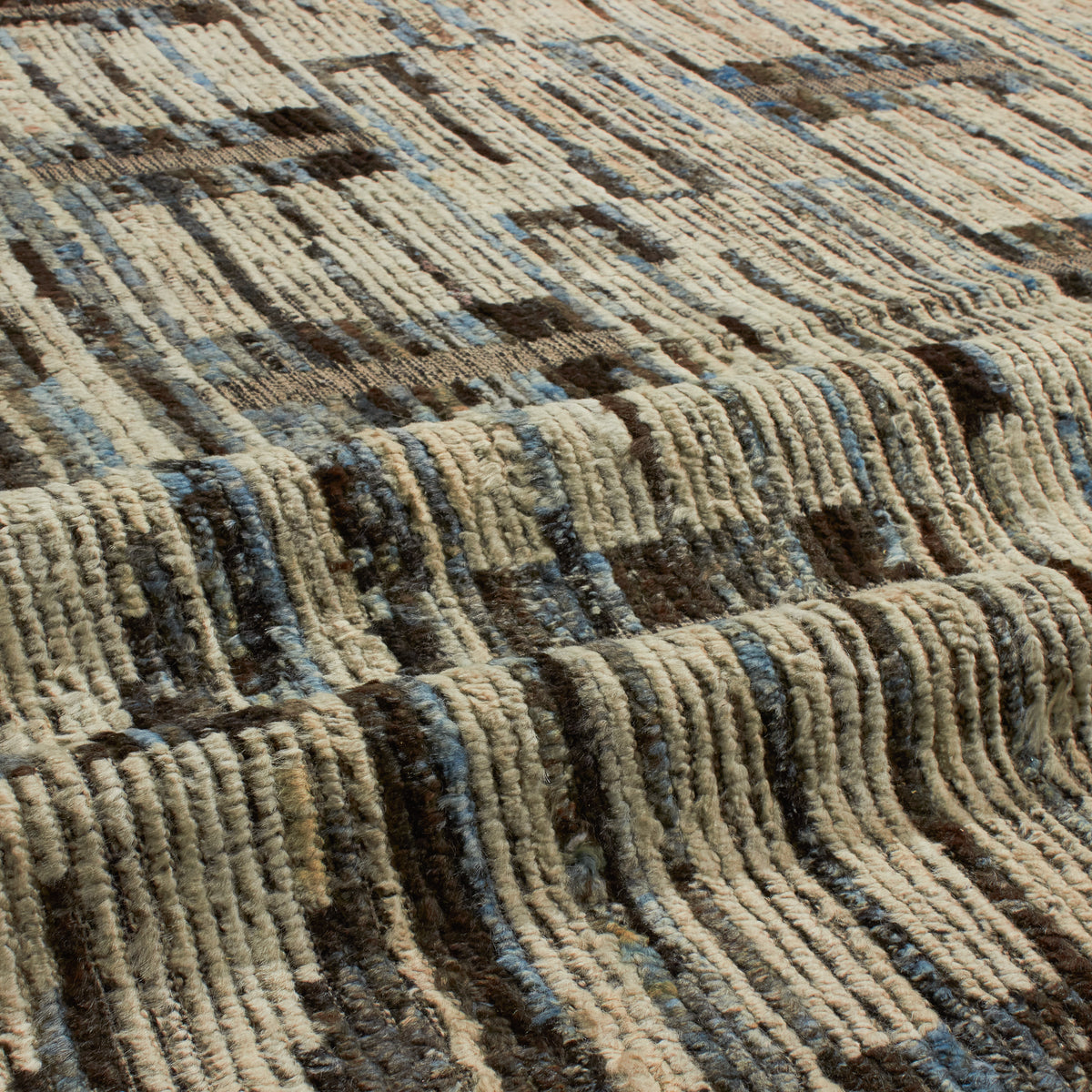Revered for its lustre and soft hand, the natural qualities of wool from ancient Karakul sheep are honoured through restraint and refinement.