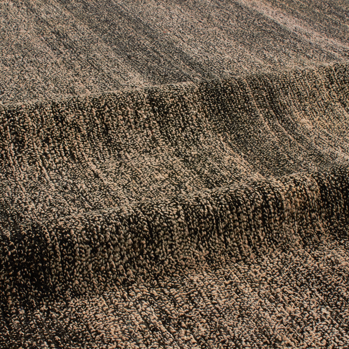 Revered for its lustre and soft hand, the natural qualities of wool from ancient Karakul sheep are honoured through restraint and refinement.