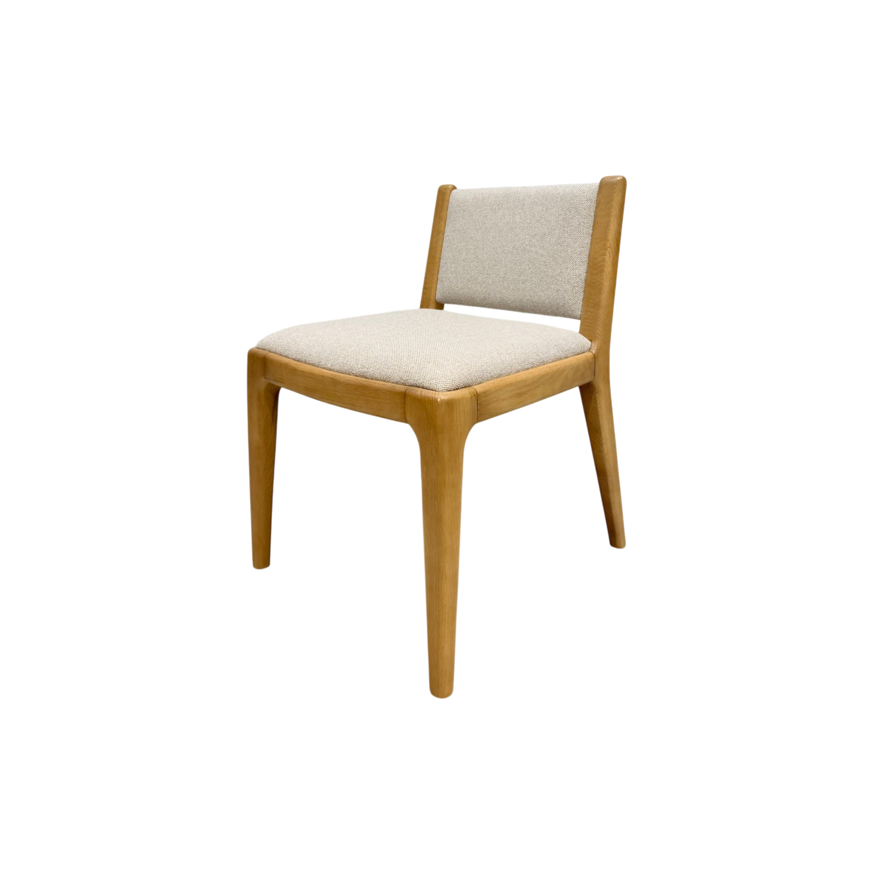 A mid-century modern style dining chair with a light oak wood frame and light beige textured fabric upholstery on the seat and backrest, shown against a plain white background.
