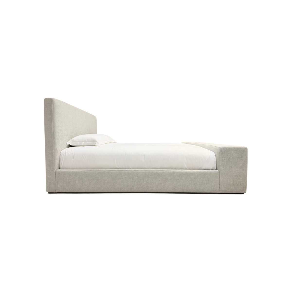 Vital King Bench Footboard Bed side view showing the low upholstered frame, tall headboard and substantial bench-style footboard.