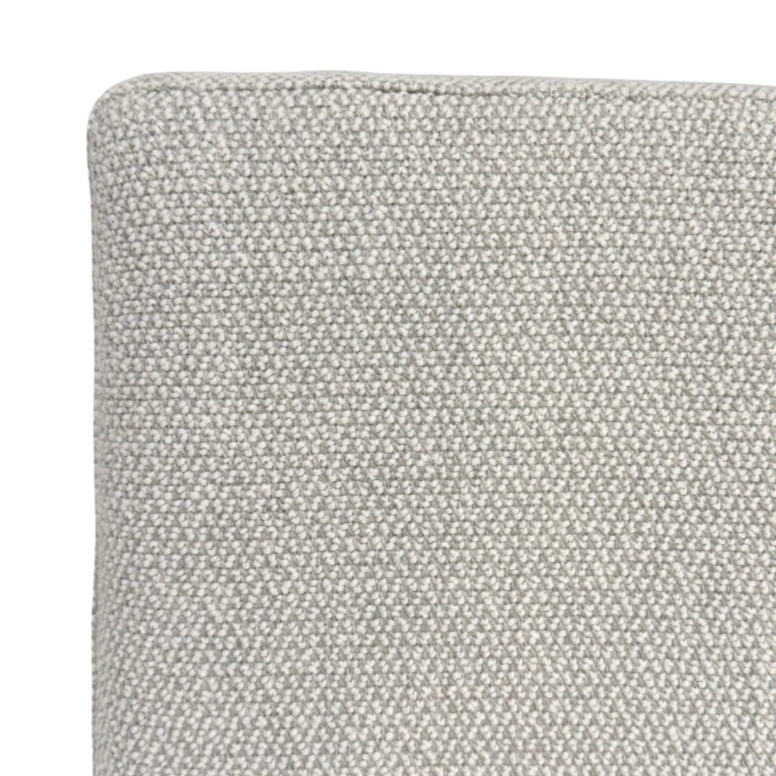 Detail view of the Vital King Bench Footboard Bed neutral woven upholstery, highlighting its textured surface and tailored finish.