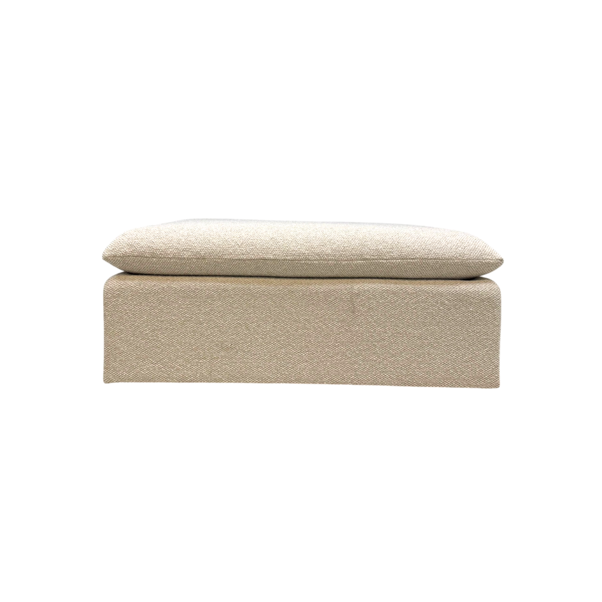 Tempo Modular Ottoman front view featuring a low-profile rectangular form, fully upholstered base, and oversized loose cushion in ivory textured fabric.