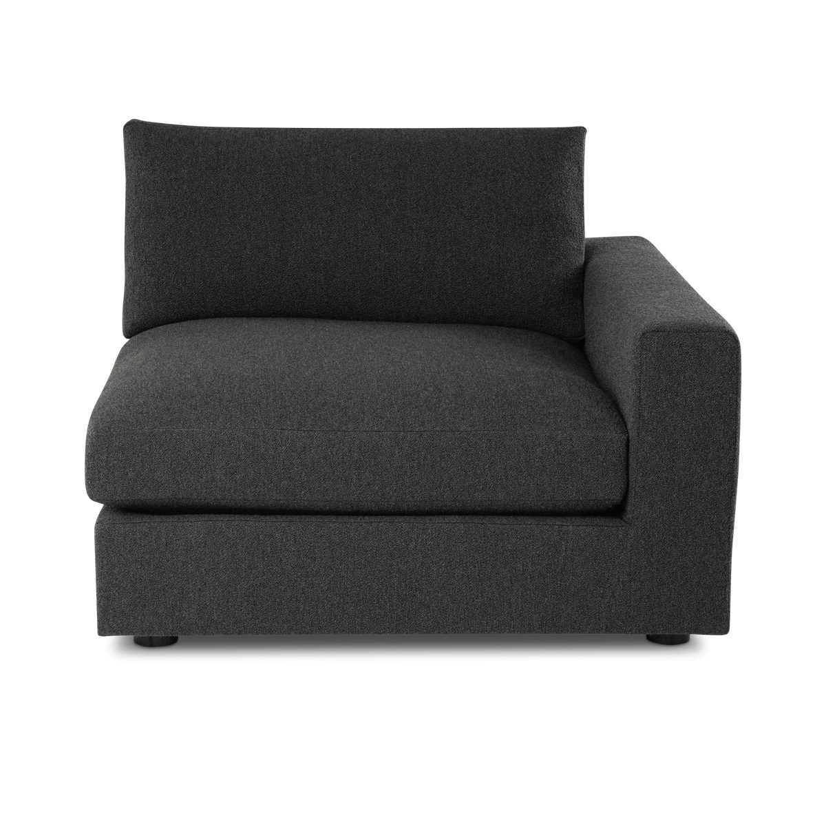 Colonna Modular RAF Chair shown from the front in charcoal bouclé upholstery, with the plush seat cushion, the rectangular back cushion, and the low round feet visible beneath the base.