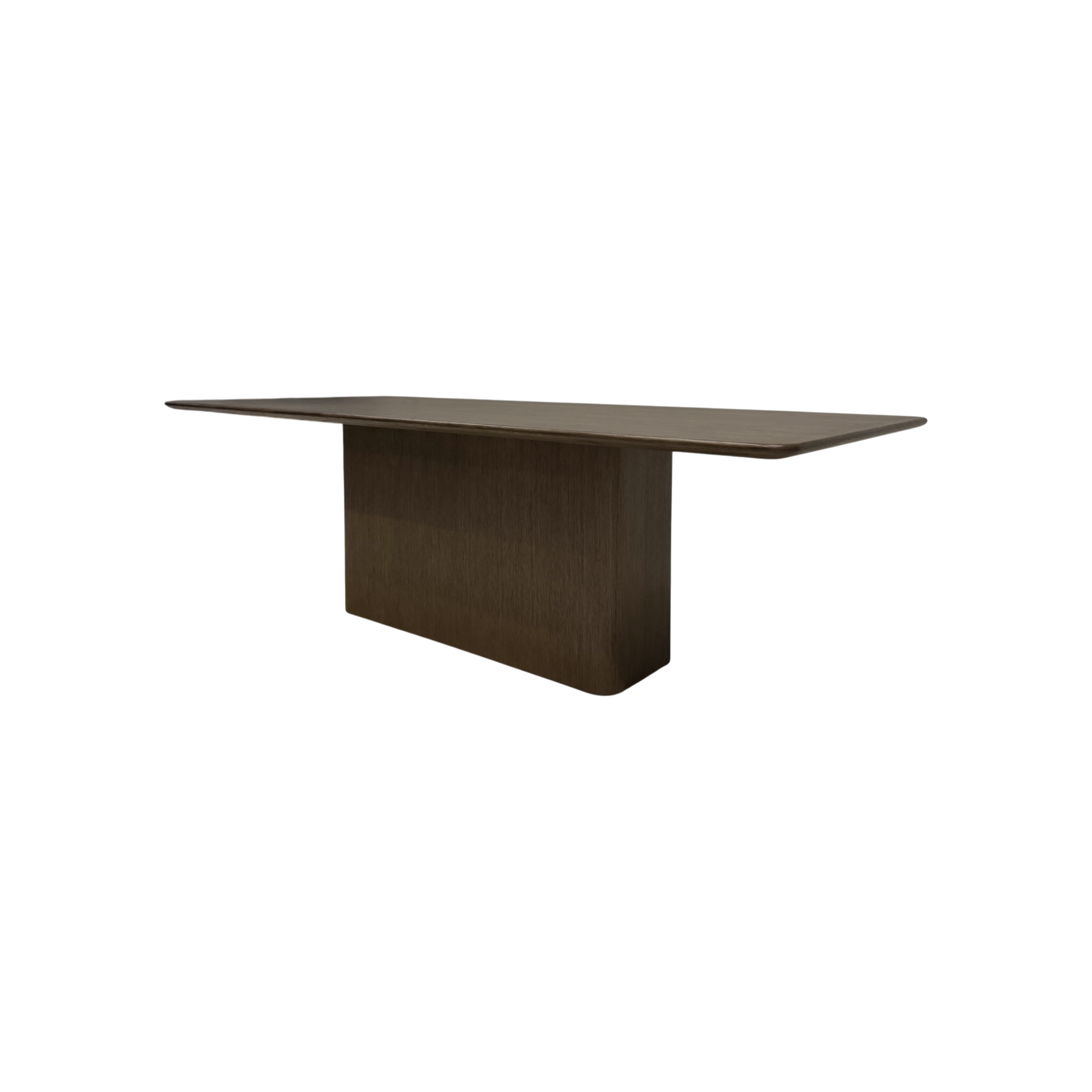 Angled view of the Altar 120-inch Dining Table showing its elongated wood top, gently softened corners and architectural pedestal base.