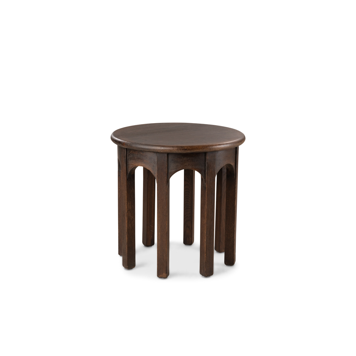 Calloway Side Table shown from the front in dark brown elm, with a round top above a repeating arcade of arched aprons and slim legs.