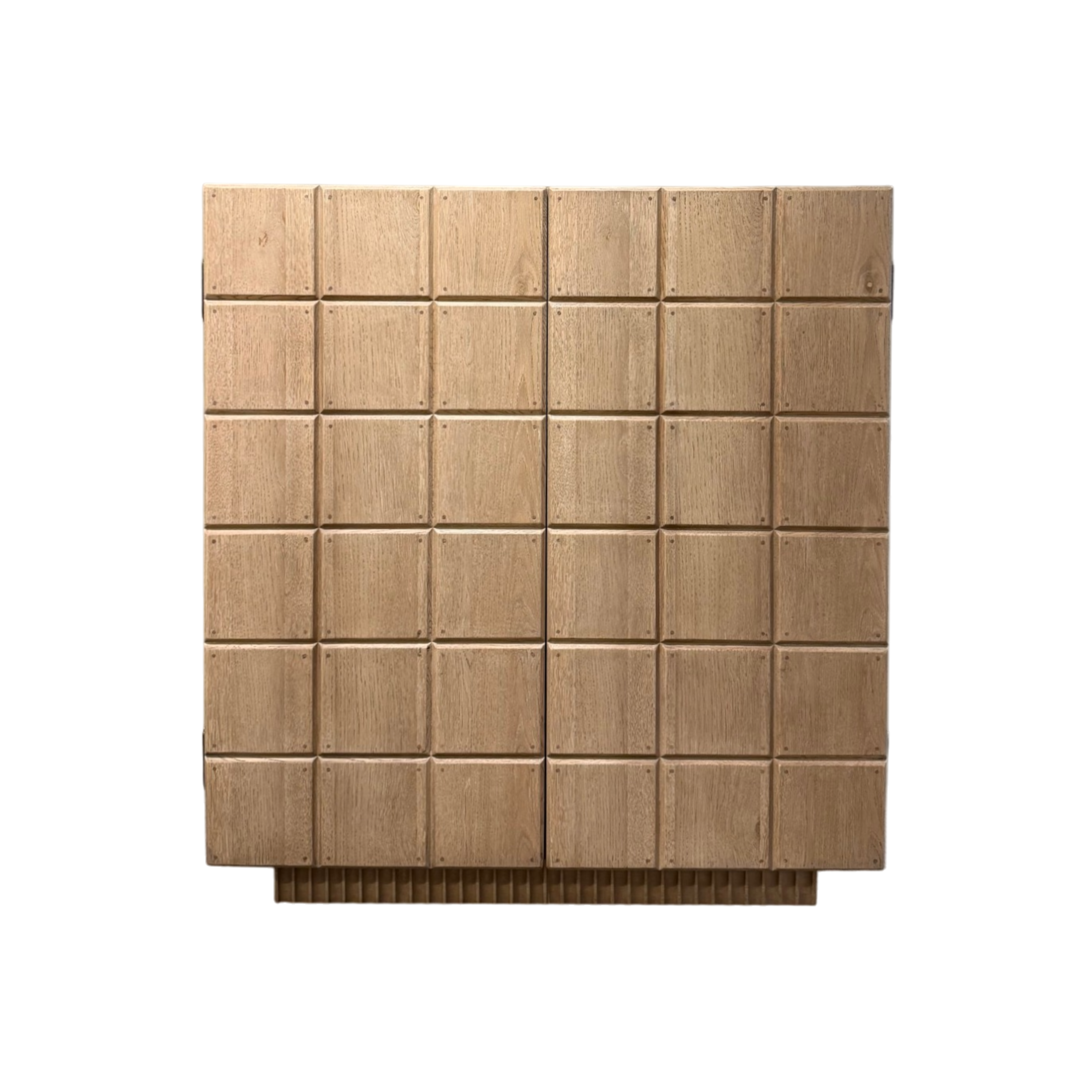 Rosedale Cabinet front view in natural oak with a geometric grid of individually pegged wood blocks and a fluted plinth base.