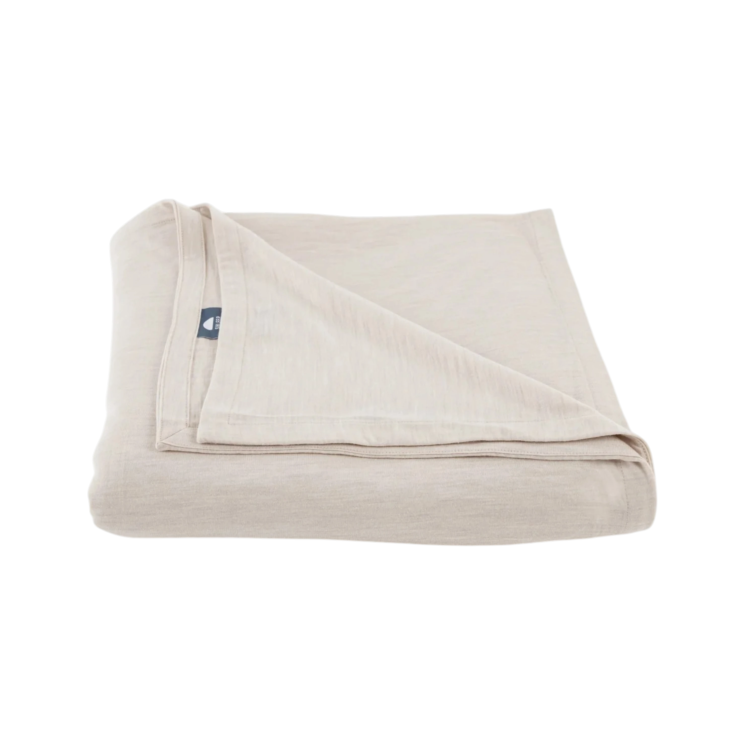 Merino Flat Sheet Queen in Ivory Merino Jersey, folded to show the soft drape, double-layered top edge and stitched finish.