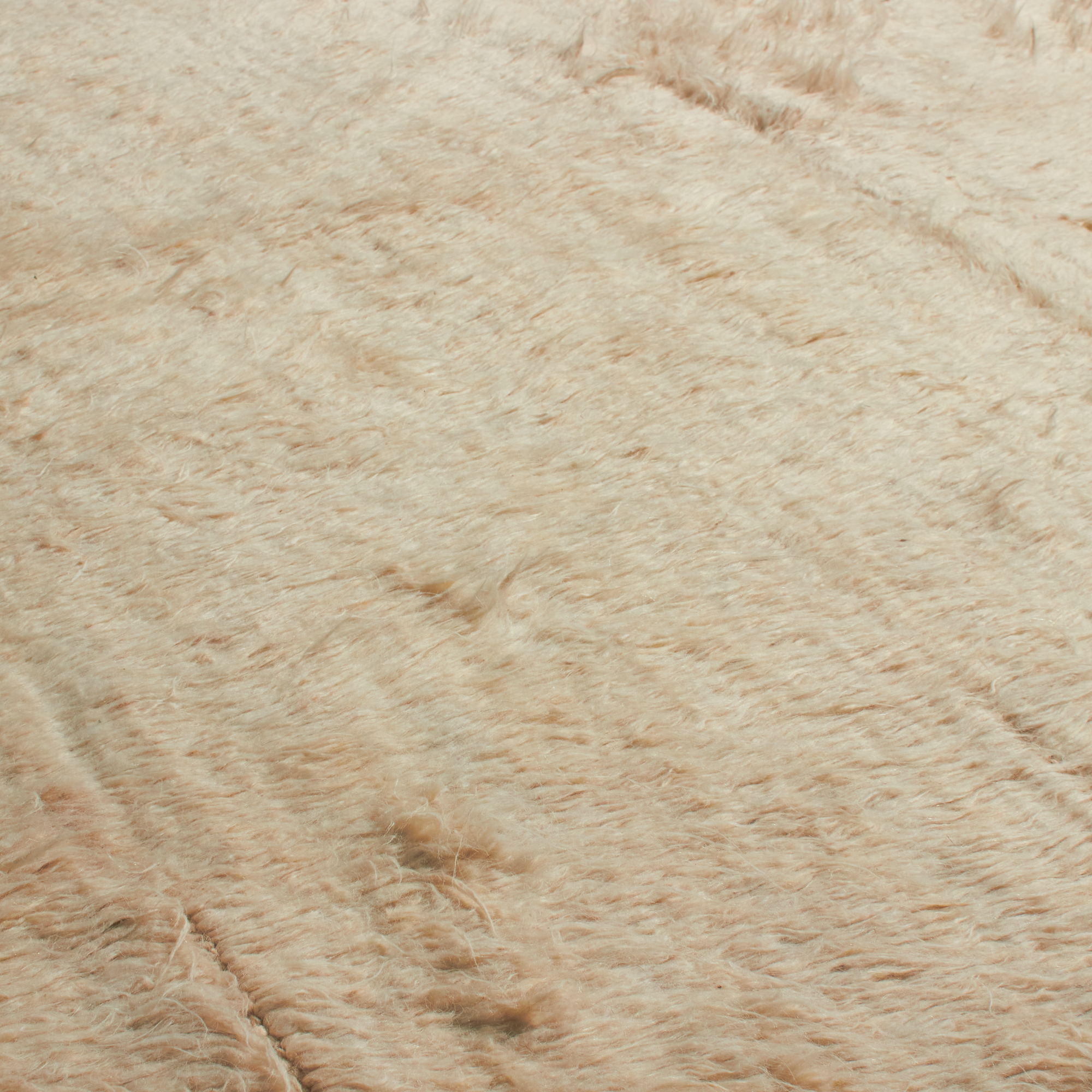 Characterized by its low pile and subtle sheen, the Kashkuli Revisited Collection features simplified and geometric designs.