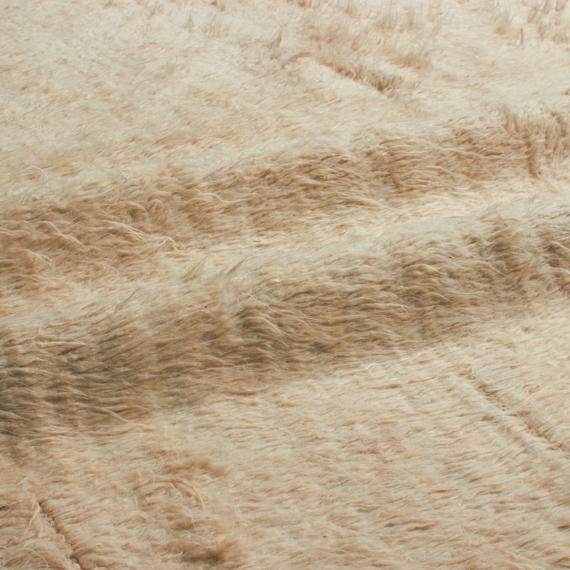Characterized by its low pile and subtle sheen, the Kashkuli Revisited Collection features simplified and geometric designs.