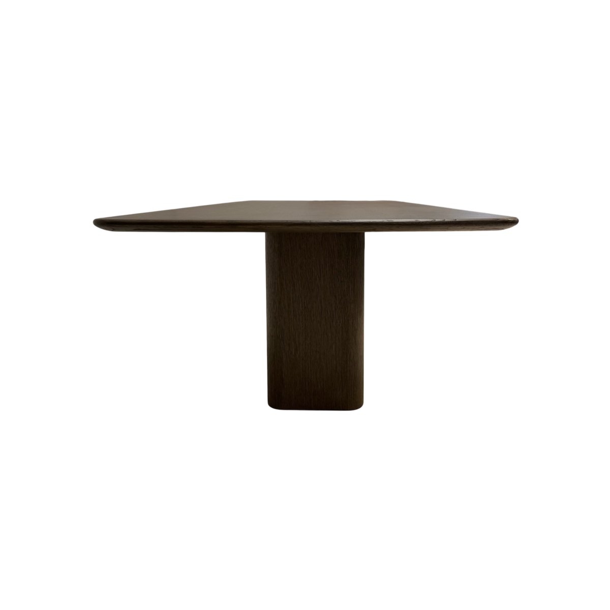 Side view of the Altar Dining Table highlighting the cantilevered tabletop, rounded profile and solid central wood pedestal.