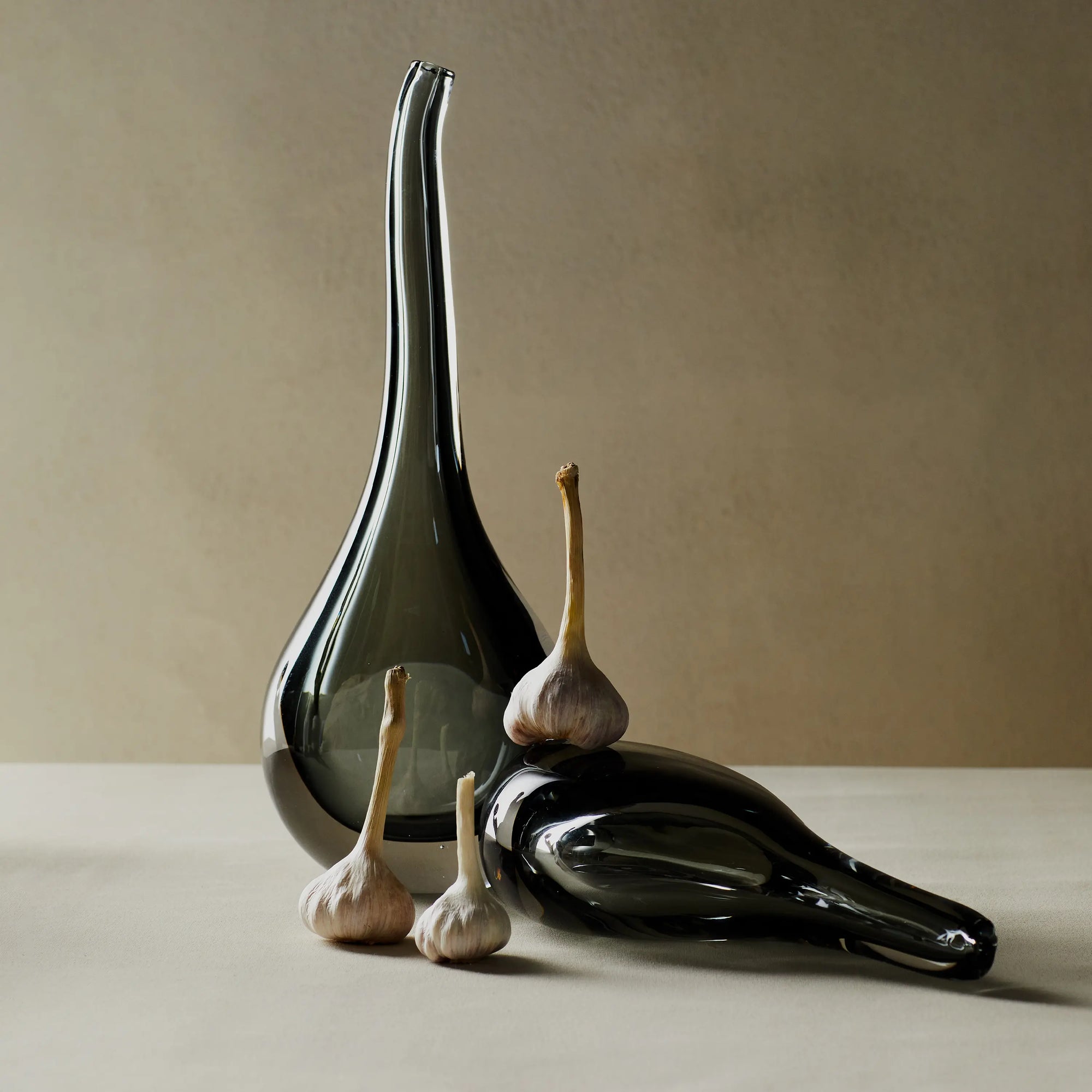 Reminiscent of a raindrop, the Stretched Neck Vase has an elegant round silhouette with a tall, long neck.