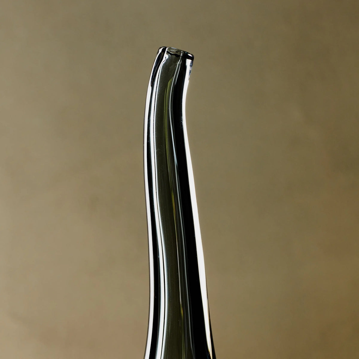 Reminiscent of a raindrop, the Stretched Neck Vase has an elegant round silhouette with a tall, long neck.