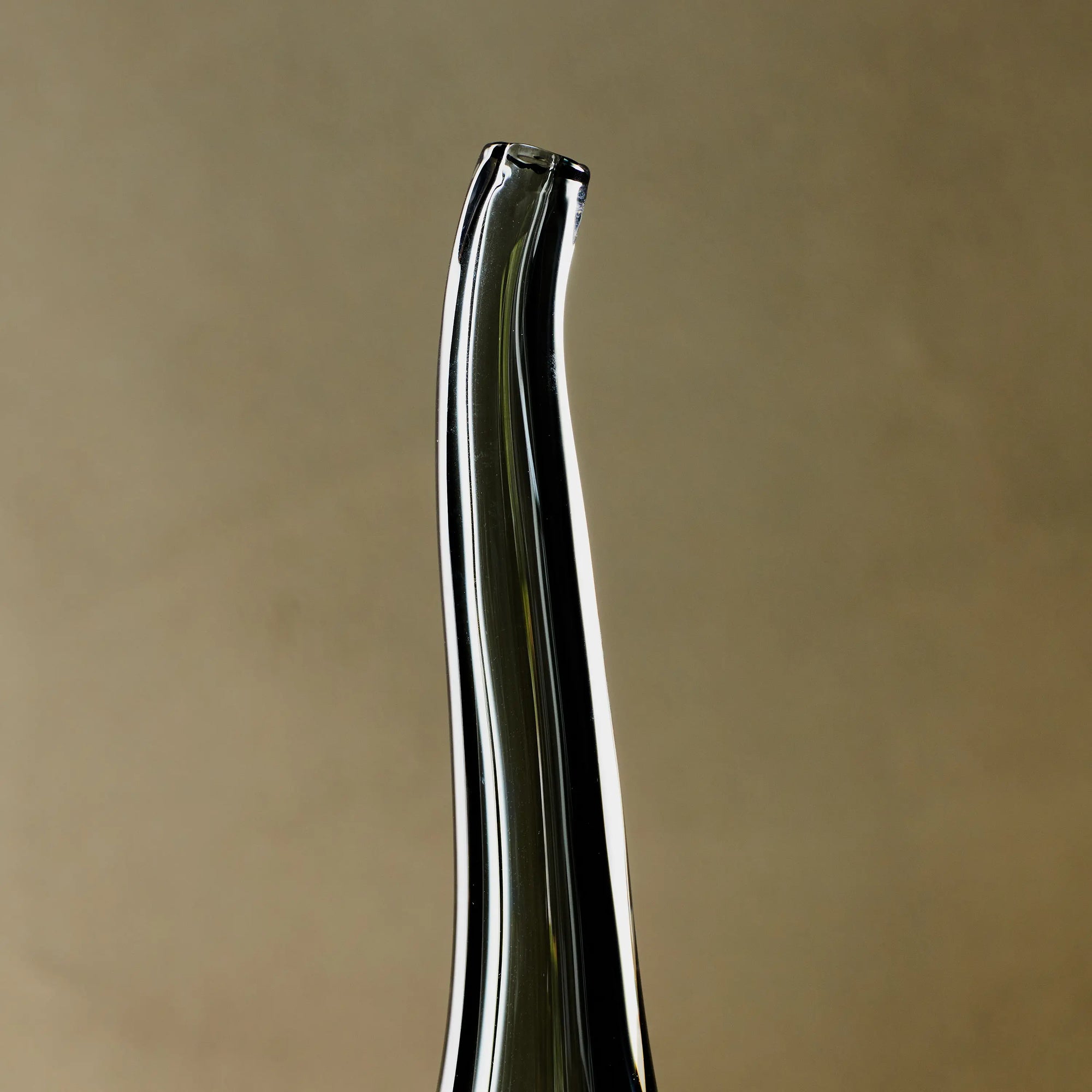 Reminiscent of a raindrop, the Stretched Neck Vase has an elegant round silhouette with a tall, long neck.