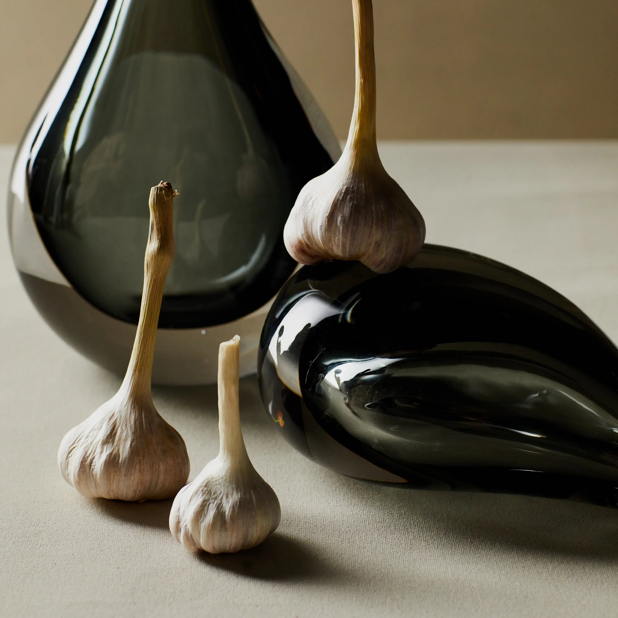 Reminiscent of a raindrop, the Stretched Neck Vase has an elegant round silhouette with a tall, long neck.