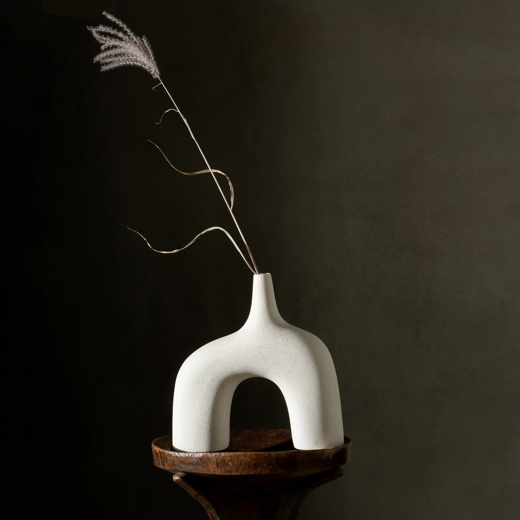Reminiscent of the 1960's lava glaze ceramics, the Stretch Vases in cream are slip cast vessels that nest/straddle each other.