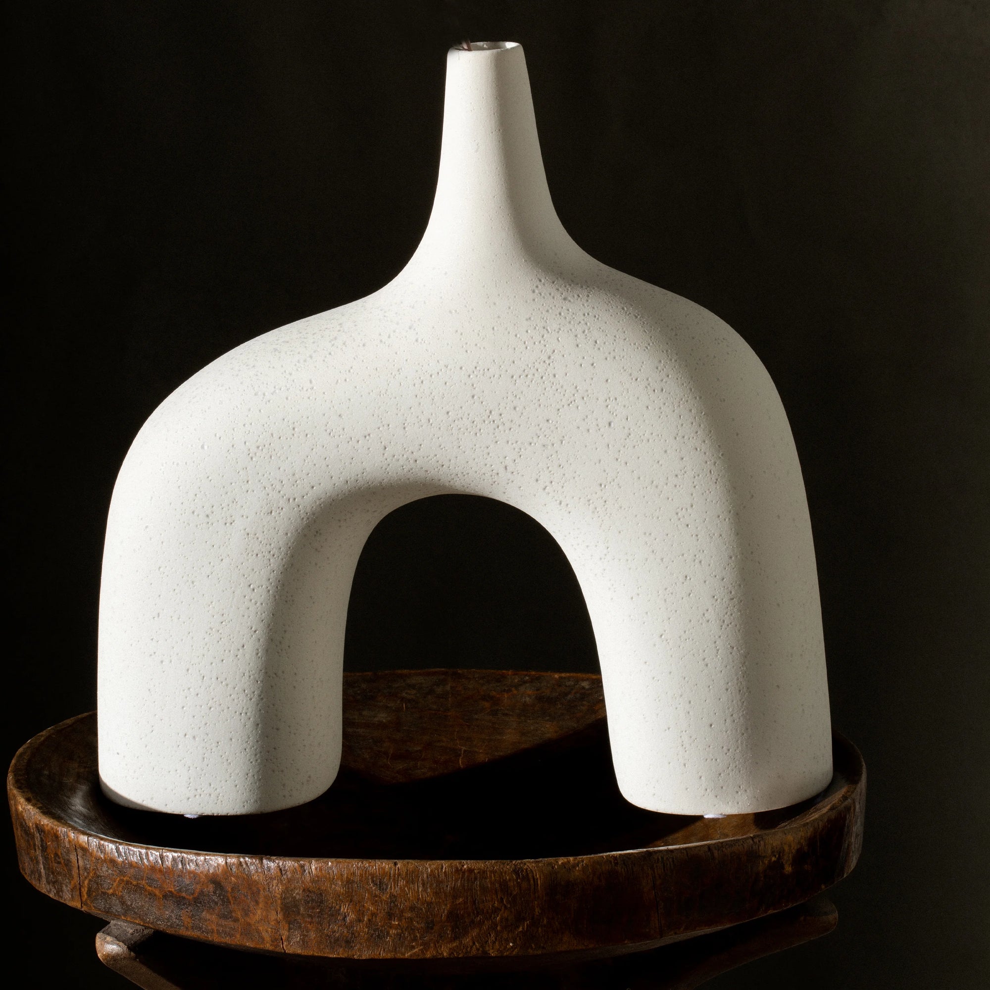 Reminiscent of the 1960's lava glaze ceramics, the Stretch Vases in cream are slip cast vessels that nest/straddle each other.