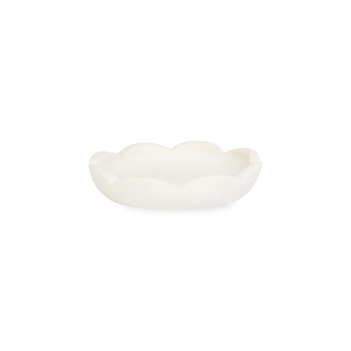 A collection of solid marble countertop pieces with a matte finish.