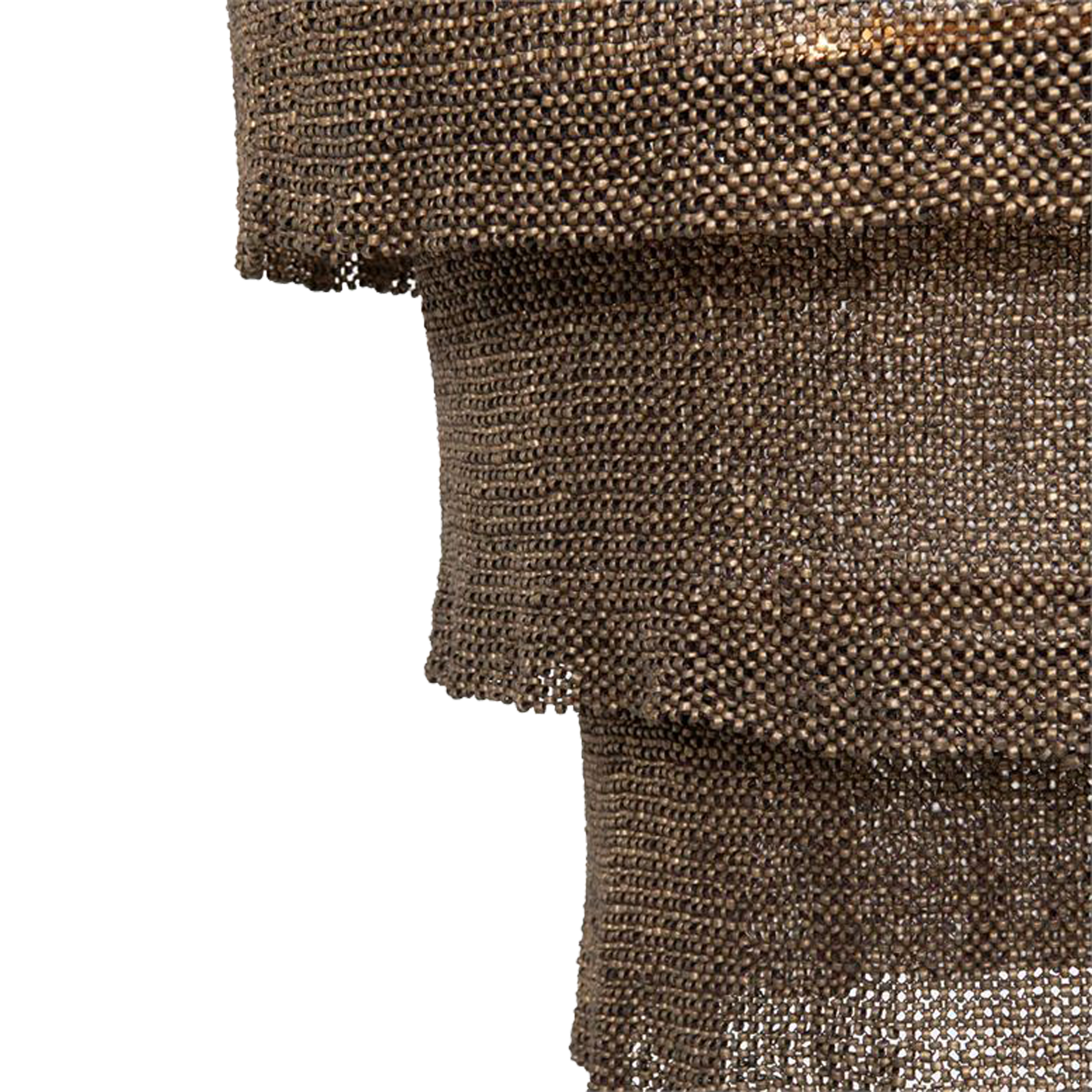 The Tiered Coco Bead Chandelier is made of woven coco beads forming three concentric rings that drop and overlap one another with a ruffle edge.