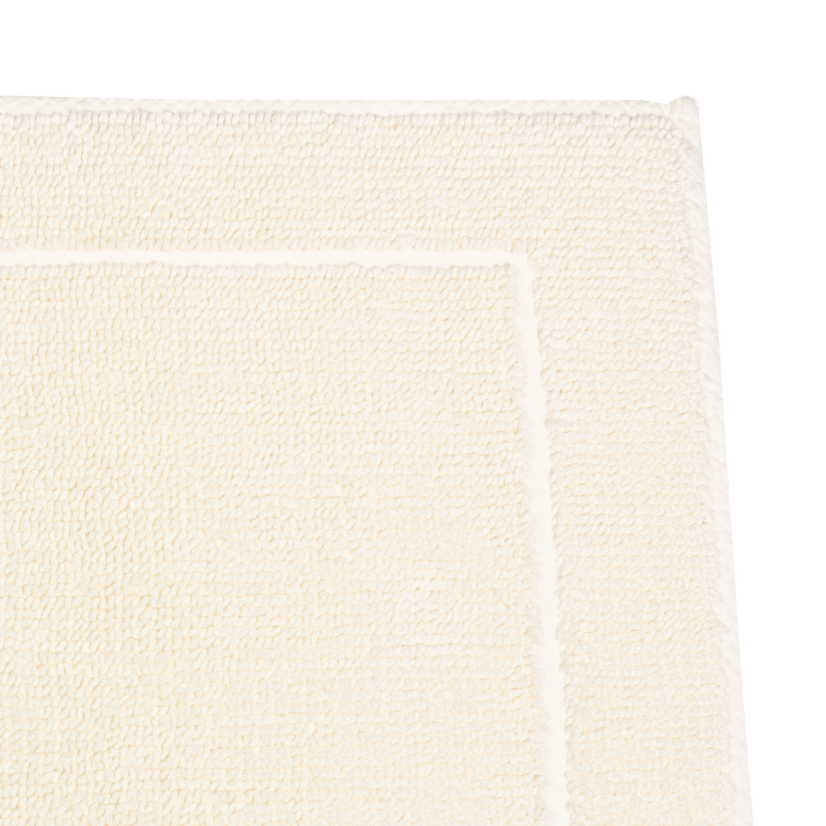 Crafted in a century-old mill in Portugal, this 100% cotton bath rug is fully reversible.