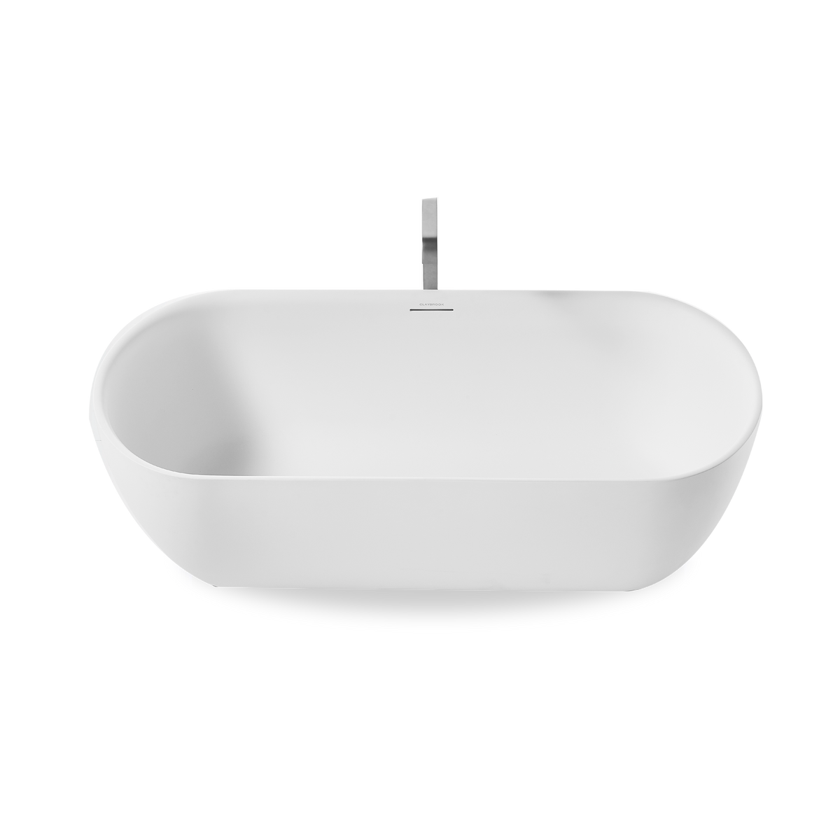 Freestanding soaker bath with tapered rim and integrated linear overflow.