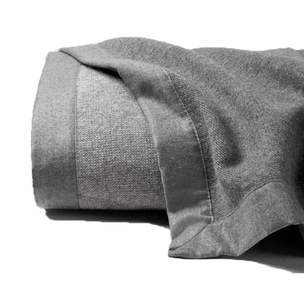 Woven in super-fine Merino wool, the Nerino blanket adds superior warmth and is reversible with differing front and back hues - grey and light grey.
