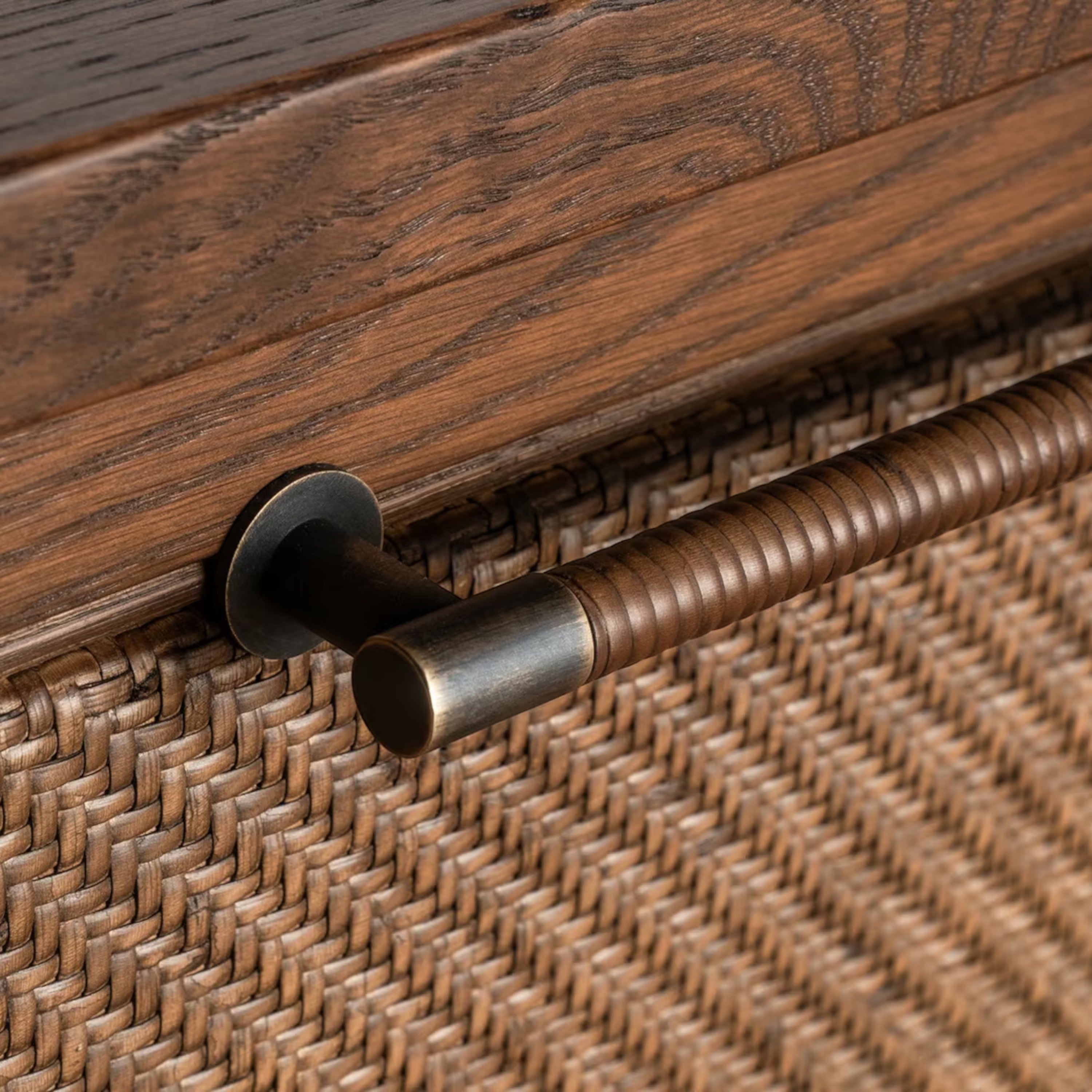 Close-up of Cabo Nightstand wrapped metal drawer pull and woven front