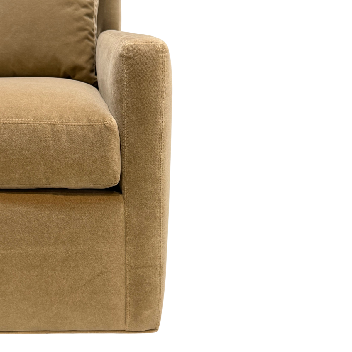 Detail view of the Weston Swivel Chair highlighting the tailored seat cushion, straight upholstered arm and warm caramel-toned fabric.