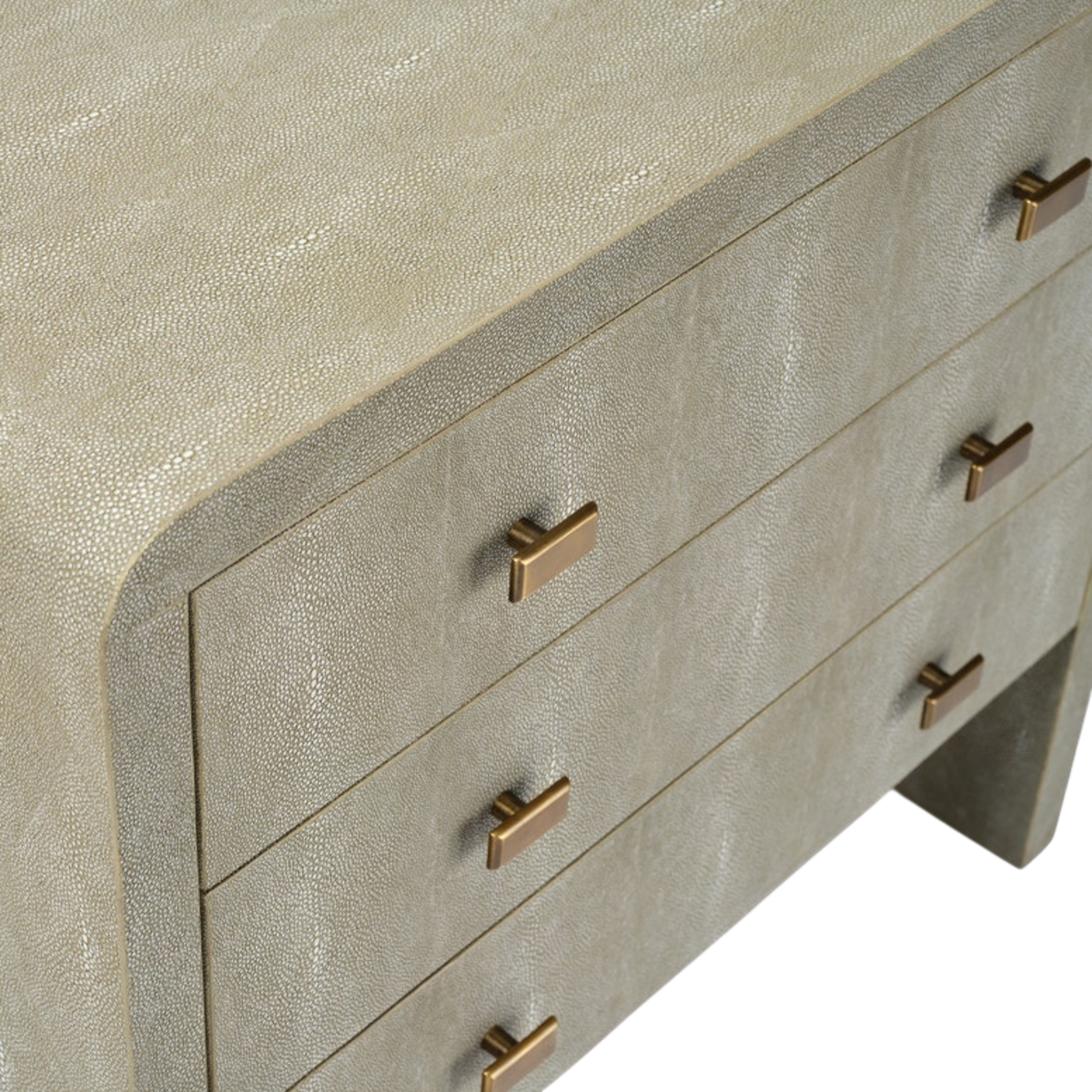 Close-up showing the Harlow Nightstand's Soft Sage faux shagreen texture, the curved top corner, and T-bar metal pulls on the stacked drawer fronts.