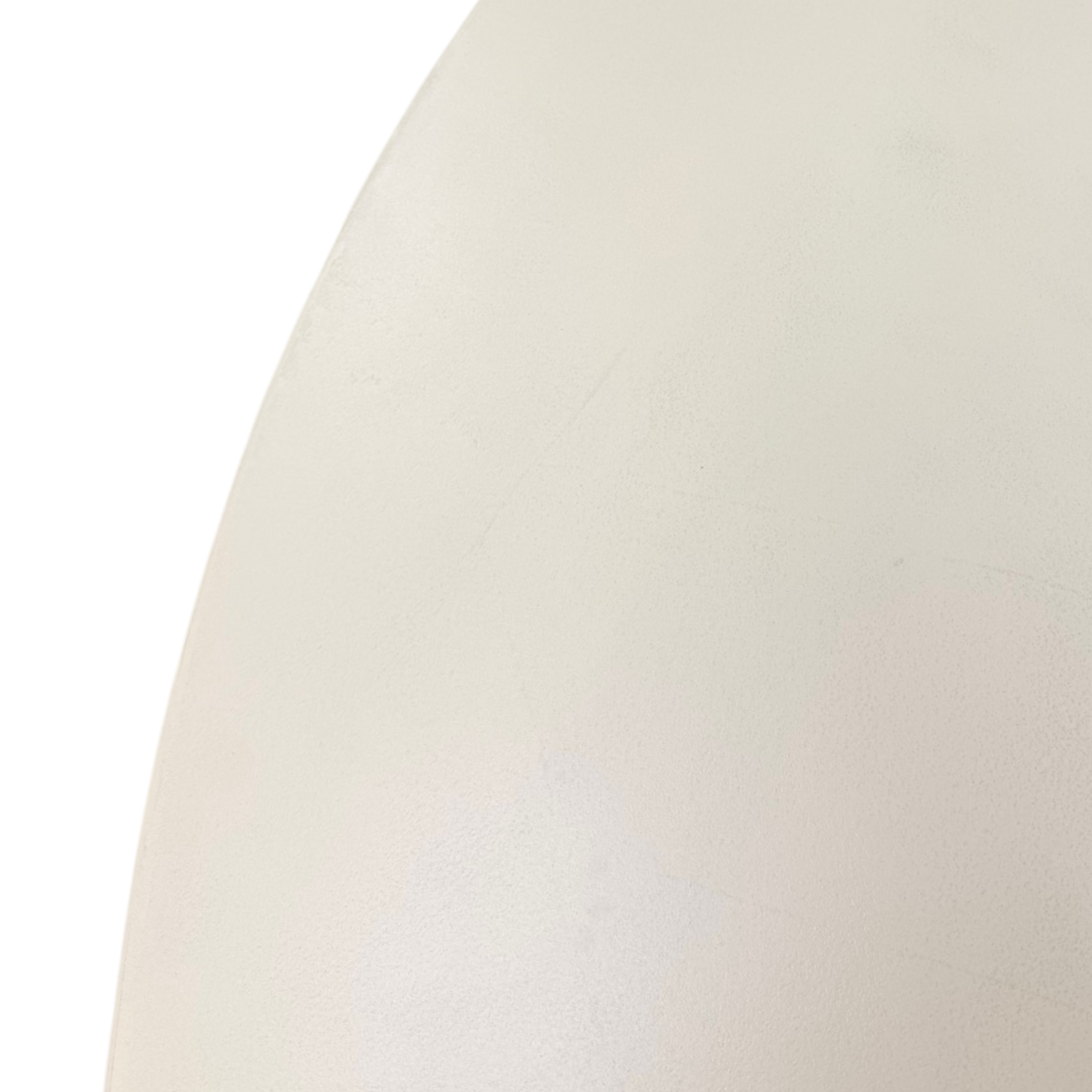 A close-up of a smooth, matte off-white or cream-colored curved surface, likely part of a product, with a clean white background visible on the left.