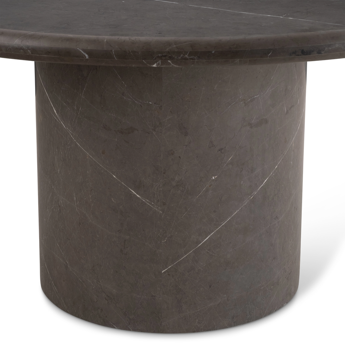 Aldo Dining Table detail view in warm gray Petra Grey marble, highlighting the cylindrical pedestal, its sweeping white veins, and the rounded rim above.