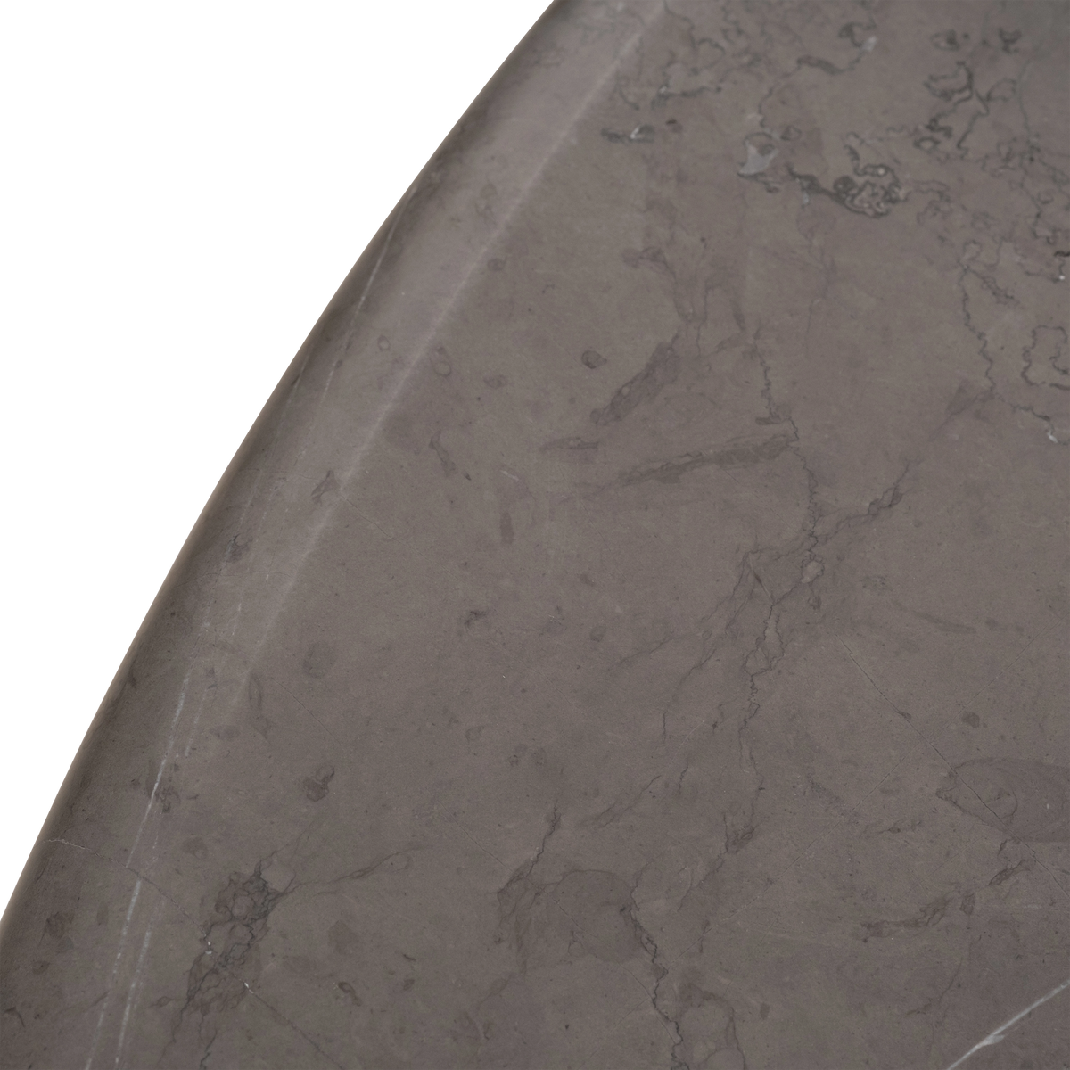 Aldo Dining Table close-up of the tabletop's curved edge in warm gray Petra Grey marble, showing soft tonal veining across the honed finish.