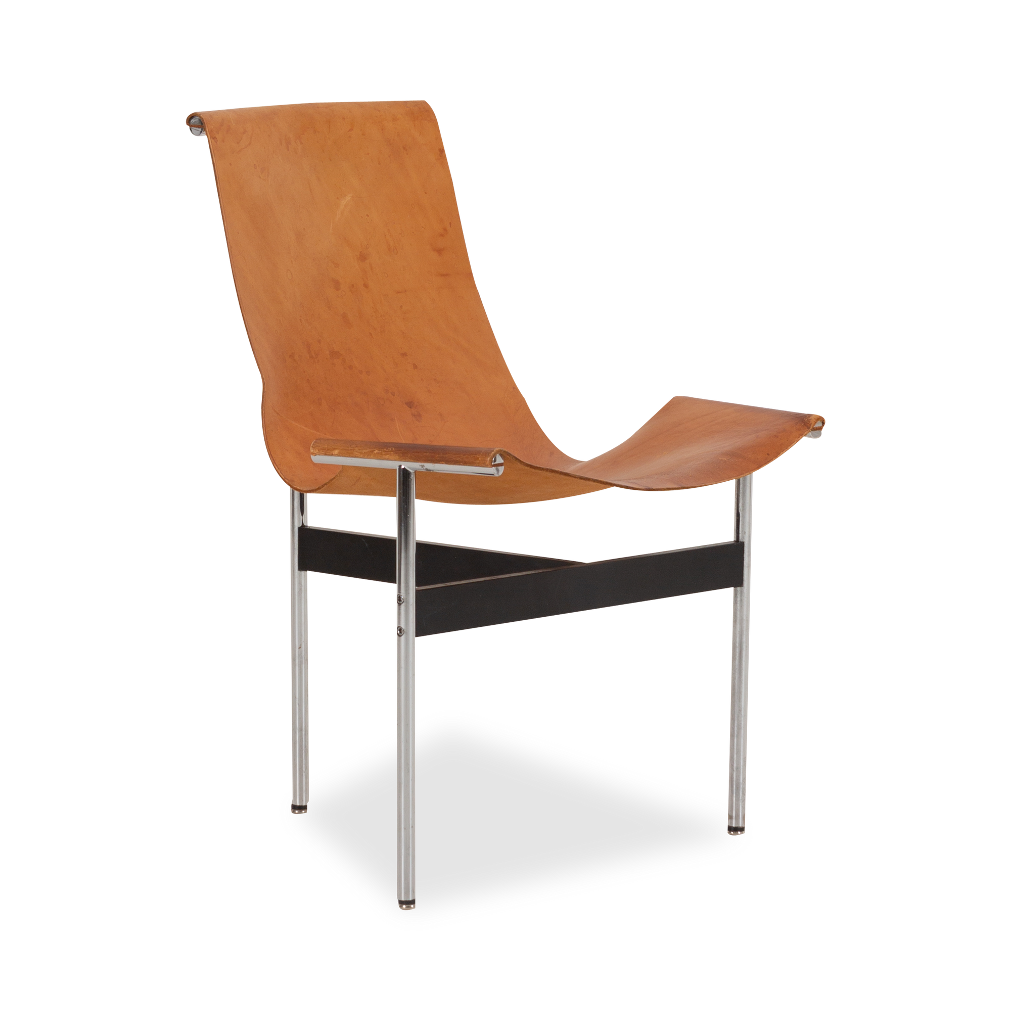 Designed in 1952, the T Chair is defined by its T-shaped silhouette.
