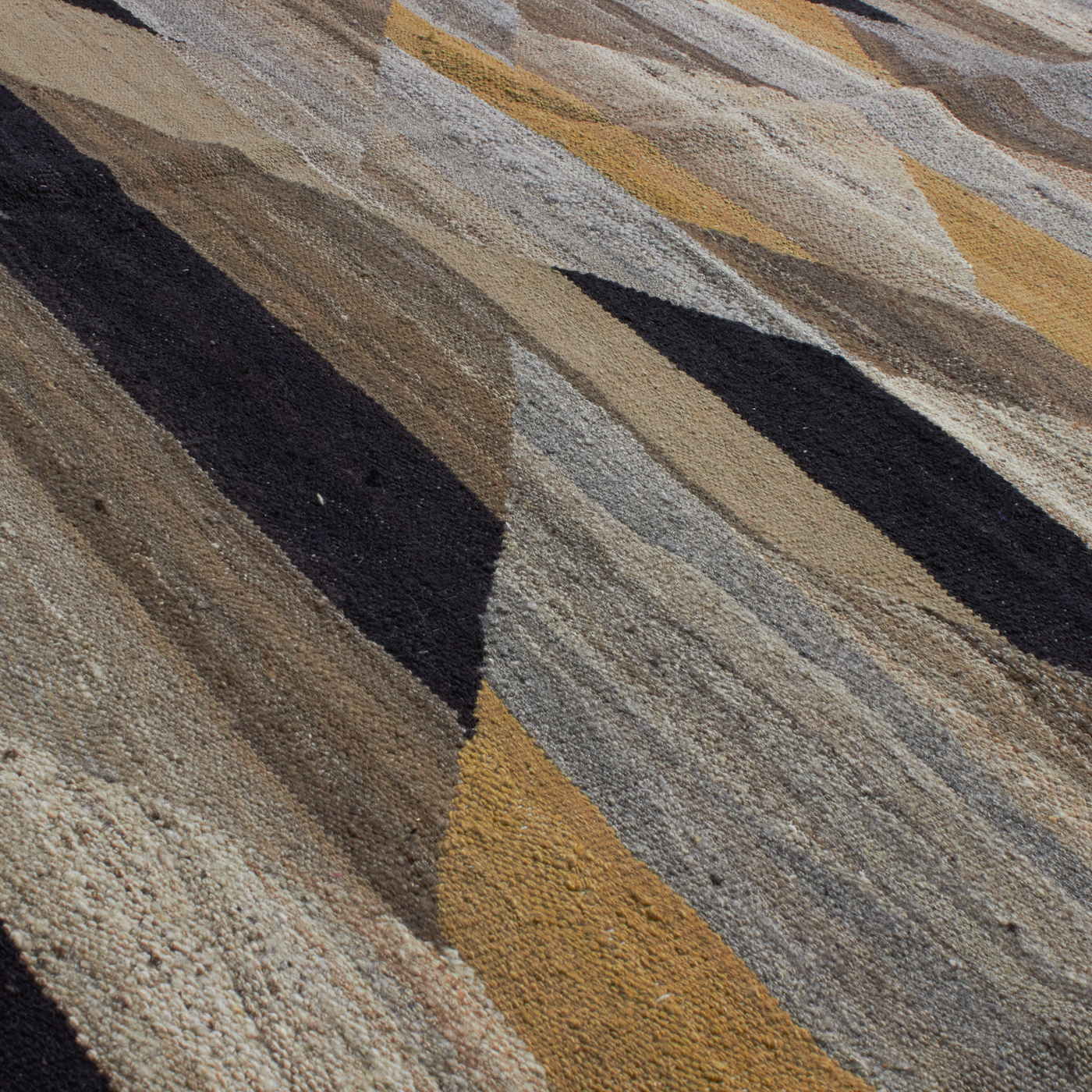 Revered for its luster and soft hand, the natural qualities of wool from ancient Karakul sheep are honored through restraint and refinement.